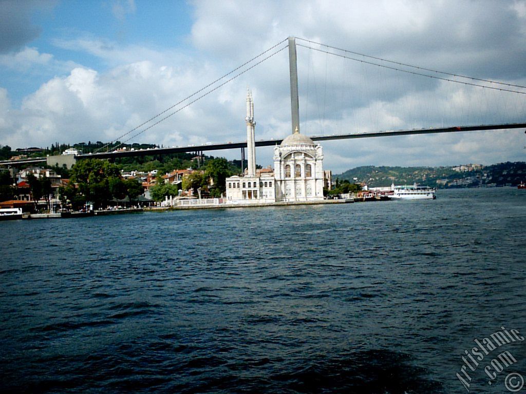 View of Ortakoy coast, Ortakoy Mosque and Bosphorus Bridge from the Bosphorus in Istanbul city of Turkey.
