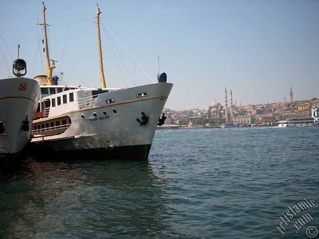 View of Eminonu coast, Yeni Cami (Mosque) and Beyazit Tower from Karakoy jetty in Istanbul city of Turkey.
