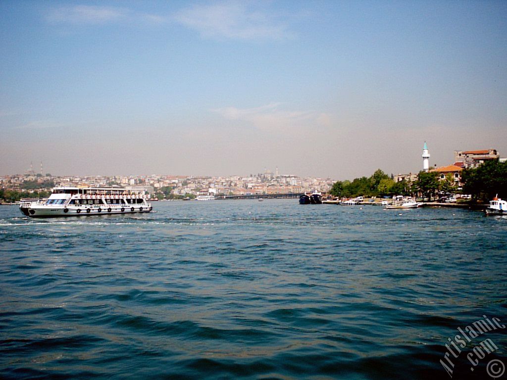 View towards Sarachane coast, on the horizon on the left Fatih Mosque, in the middle Yavuz Sultan Selim Mosque and a small mosque from under Galata Bridge located in Istanbul city of Turkey.
