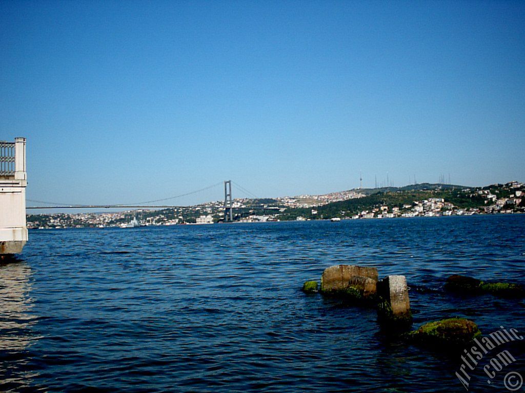 View of the Bosphorus Bridge, Camlica Hill and Uskudar-Beylerbeyi coast from a park at Besiktas shore in Istanbul city of Turkey.
