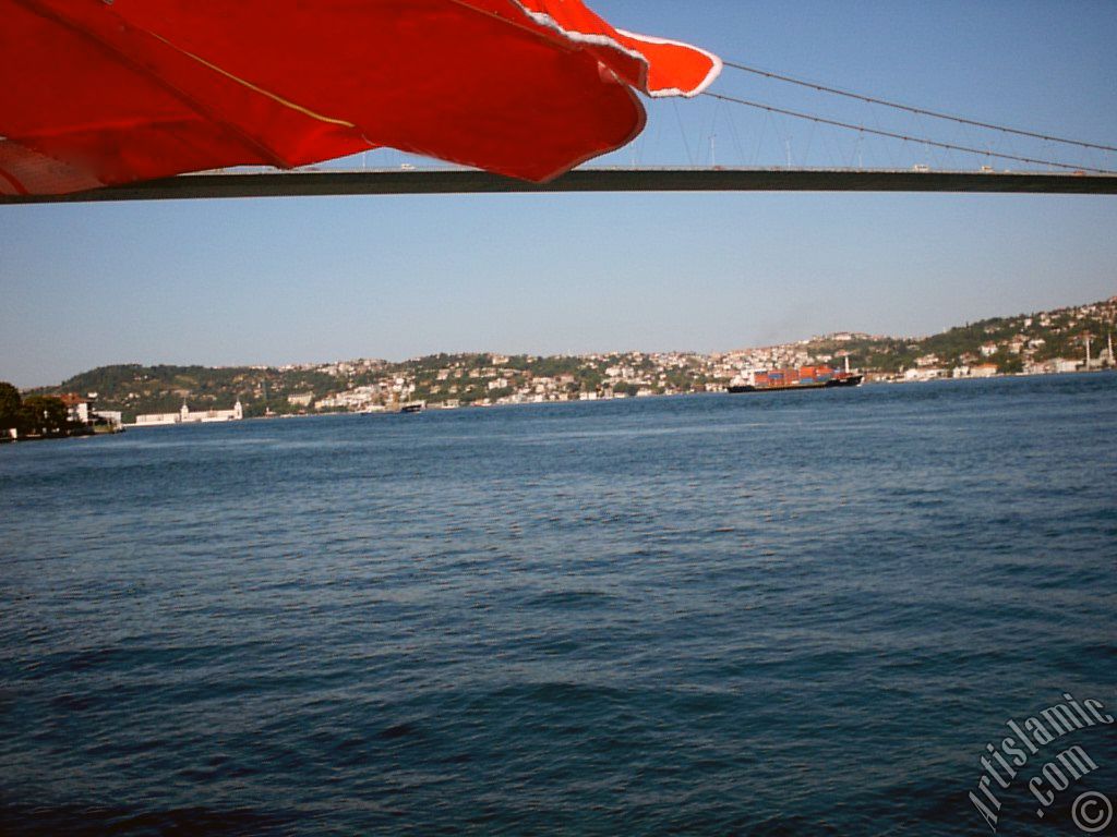 View of Bosphorus Bridge and Beylerbeyi-Kuleli coast from a park at Ortakoy shore in Istanbul city of Turkey.
