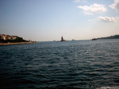 View of Uskudar coast, Kiz Kulesi (Maiden`s Tower) and Sarayburnu coast from the Bosphorus in Istanbul city of Turkey. (The picture was taken by Artislamic.com in 2004.)