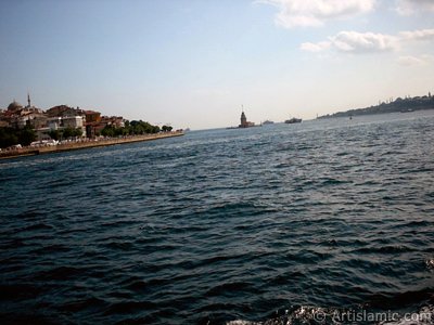 View of Uskudar coast, Kiz Kulesi (Maiden`s Tower) and Sarayburnu coast from the Bosphorus in Istanbul city of Turkey. (The picture was taken by Artislamic.com in 2004.)