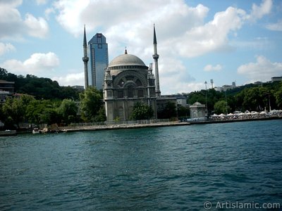 View of Dolmabahce coast and Valide Sultan Mosque from the Bosphorus in Istanbul city of Turkey. (The picture was taken by Artislamic.com in 2004.)