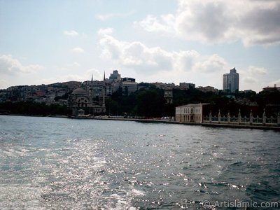 View of Dolmabahce Palace and Valide Sultan Mosque from the Bosphorus in Istanbul city of Turkey. (The picture was taken by Artislamic.com in 2004.)