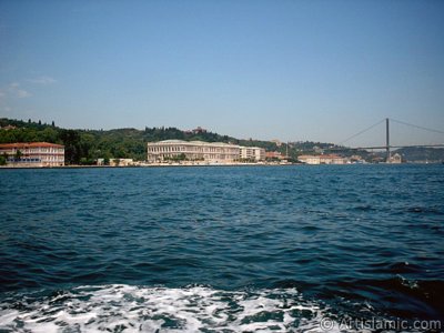 View of the Ciragan Palace and the Bosphorus Bridge from the Bosphorus in Istanbul city of Turkey. (The picture was taken by Artislamic.com in 2004.)