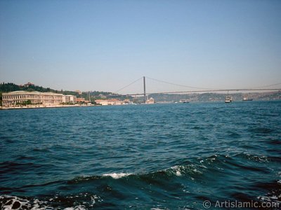View of the Ciragan Palace and the Bosphorus Bridge from the Bosphorus in Istanbul city of Turkey. (The picture was taken by Artislamic.com in 2004.)