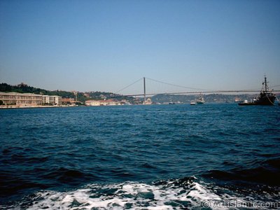 View of the Ciragan Palace and the Bosphorus Bridge from the Bosphorus in Istanbul city of Turkey. (The picture was taken by Artislamic.com in 2004.)
