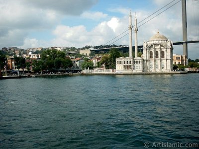 View of Ortakoy coast, Ortakoy Mosque and Bosphorus Bridge from the Bosphorus in Istanbul city of Turkey. (The picture was taken by Artislamic.com in 2004.)