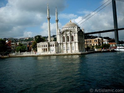 View of Ortakoy coast, Ortakoy Mosque and Bosphorus Bridge from the Bosphorus in Istanbul city of Turkey. (The picture was taken by Artislamic.com in 2004.)