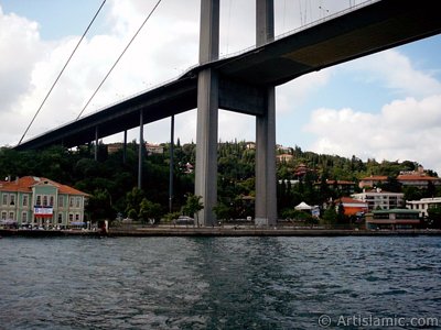 View of Ortakoy coast and Bosphorus Bridge from the Bosphorus in Istanbul city of Turkey. (The picture was taken by Artislamic.com in 2004.)