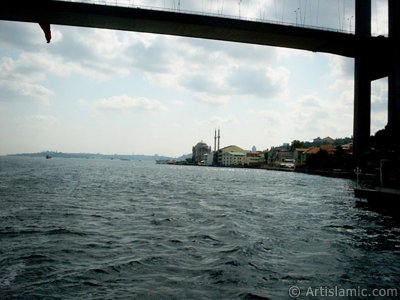 View of Ortakoy coast, Bosphorus Bridge and Ortakoy Mosque from the Bosphorus in Istanbul city of Turkey. (The picture was taken by Artislamic.com in 2004.)