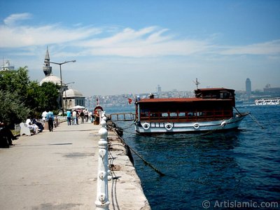 View of the shore, a fisher boat and Semsi Pasha Mosque in Uskudar district of Istanbul city of Turkey. (The picture was taken by Artislamic.com in 2004.)