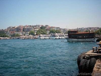 View of the shore and a fisher boat in Uskudar district of Istanbul city of Turkey. (The picture was taken by Artislamic.com in 2004.)