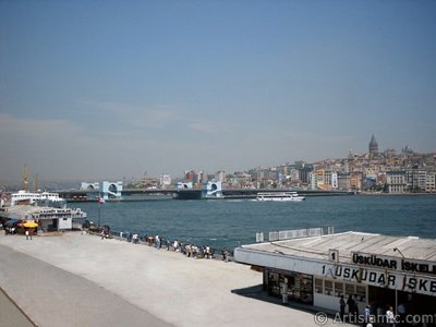 View of jetties, square, Galata Bridge and historical Galata Tower from an overpass at Eminonu district in Istanbul city of Turkey. (The picture was taken by Artislamic.com in 2004.)