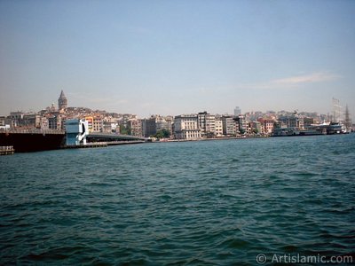 View of Karakoy coast, Galata Bridge and Galata Tower from the shore of Eminonu in Istanbul city of Turkey. (The picture was taken by Artislamic.com in 2004.)