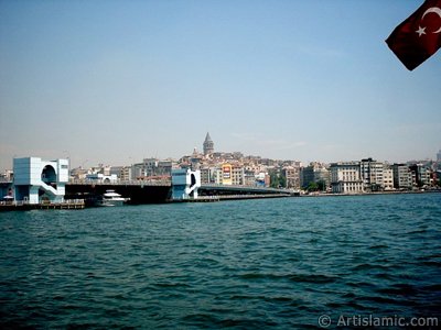 View of Karakoy coast, Galata Bridge and Galata Tower from the shore of Eminonu in Istanbul city of Turkey. (The picture was taken by Artislamic.com in 2004.)