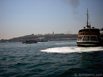 View of Eminonu coast, the ship and Topkapi Palace from the shore of Karakoy in Istanbul city of Turkey. (The picture was taken by Artislamic.com in 2004.)