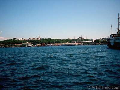 View of Eminonu coast, Ayasofya Mosque (Hagia Sophia) and Topkapi Palace from the shore of Karakoy in Istanbul city of Turkey. (The picture was taken by Artislamic.com in 2004.)