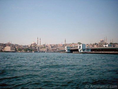 View of Eminonu coast, (from left) Sultan Ahmet Mosque (Blue Mosque), Yeni Cami (Mosque), (at far behind) Beyazit Mosque, Beyazit Tower, Galata Brigde and Suleymaniye Mosque from the shore of Karakoy in Istanbul city of Turkey. (The picture was taken by Artislamic.com in 2004.)