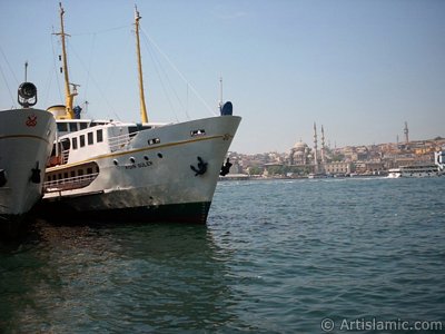 View of Eminonu coast, Yeni Cami (Mosque) and Beyazit Tower from Karakoy jetty in Istanbul city of Turkey. (The picture was taken by Artislamic.com in 2004.)