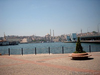 View of Eminonu coast, (from left) Sultan Ahmet Mosque (Blue Mosque), Yeni Cami (Mosque), (at far behind) Beyazit Mosque, Beyazit Tower and Galata Brigde from the shore of Karakoy in Istanbul city of Turkey. (The picture was taken by Artislamic.com in 2004.)