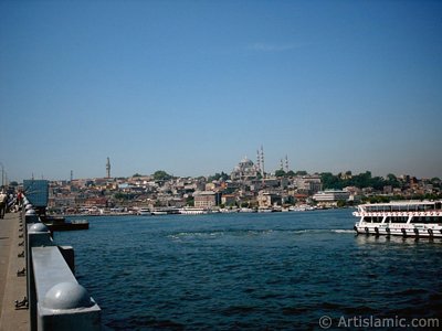 View of coast, (from left) Beyazit Tower, below Rustem Pasha Mosque and above it Suleymaniye Mosque from Galata Bridge located in Istanbul city of Turkey. (The picture was taken by Artislamic.com in 2004.)