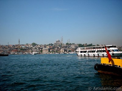 View of Eminonu coast, (from left) Beyazit Tower, (below) Rustem Pasha Mosque and (above) Suleymaniye Mosque from the shore of Karakoy-Persembe Pazari in Istanbul city of Turkey. (The picture was taken by Artislamic.com in 2004.)