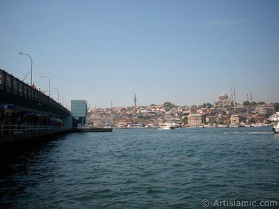 View of Eminonu coast, (from left) Galata Bridge, Beyazit Tower, (below) Rustem Pasha Mosque and (above) Suleymaniye Mosque from the shore of Karakoy-Persembe Pazari in Istanbul city of Turkey. (The picture was taken by Artislamic.com in 2004.)
