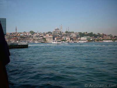 View of Eminonu coast, (from left) Beyazit Tower, (below) Rustem Pasha Mosque and (above) Suleymaniye Mosque from the shore of Karakoy-Persembe Pazari in Istanbul city of Turkey. (The picture was taken by Artislamic.com in 2004.)