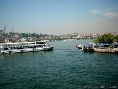 View of Karakoy-Persembe Pazari coast, Suleymaniye Mosque and on the horizon Fatih Mosque from Galata Bridge located in Istanbul city of Turkey. (The picture was taken by Artislamic.com in 2004.)