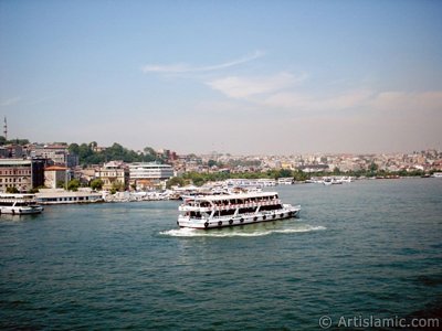 View of Eminonu-Sarachane coast, on the horizon in the middle Fatih Mosque and on the right Yavuz Sultan Selim Mosque from Galata Bridge located in Istanbul city of Turkey. (The picture was taken by Artislamic.com in 2004.)