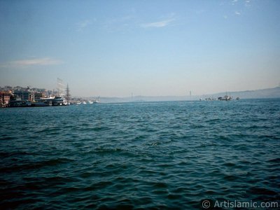 View towards Bosphorus, on the left Karakoy shore and on the horizon the Bosphorus Bridge from under Galata Bridge located in Istanbul city of Turkey. (The picture was taken by Artislamic.com in 2004.)