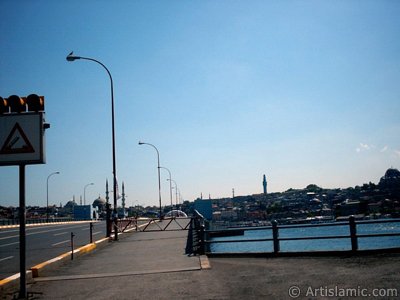 View towards the shore, (from right) Suleymaniye Mosque, Beyazit Tower, (at far behind) Beyazit Mosque, Yeni Cami (Mosque) and Sultan Ahmet Mosque (Blue Mosque) from Galata Bridge located in Istanbul city of Turkey. (The picture was taken by Artislamic.com in 2004.)