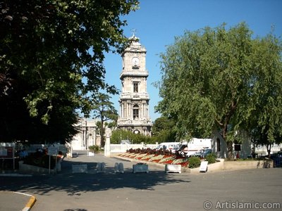 View of Dolmabahce Palace`s entrance and clock tower located in Dolmabahce district in Istanbul city of Turkey. (The picture was taken by Artislamic.com in 2004.)