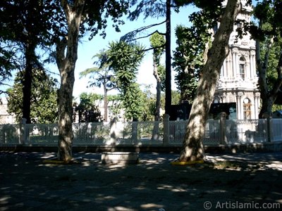 View of Dolmabahce Palace`s entrance and clock tower located in Dolmabahce district in Istanbul city of Turkey. (The picture was taken by Artislamic.com in 2004.)