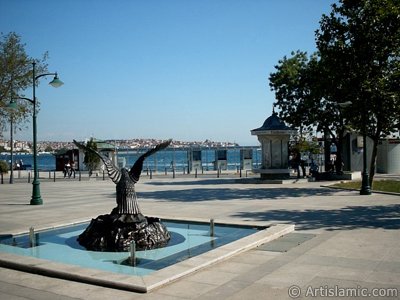 View of a park on the shore of Besiktas district and the coast of Uskudar on the horizon in Istanbul city of Turkey. (The picture was taken by Artislamic.com in 2004.)