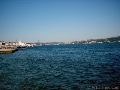 View towards jetty, Bosphorus Bridge and Uskudar coast from a park at Kabatas shore in Istanbul city of Turkey. (The picture was taken by Artislamic.com in 2004.)