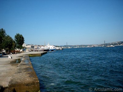 View towards jetty, Bosphorus Bridge and Uskudar coast from a park at Kabatas shore in Istanbul city of Turkey. (The picture was taken by Artislamic.com in 2004.)