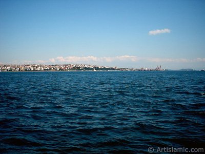 View towards Kiz Kulesi (Maiden`s Tower) and Uskudar-Harem coast from a park at Kabatas shore in Istanbul city of Turkey. (The picture was taken by Artislamic.com in 2004.)