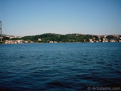 View of Bosphorus Bridge and Beylerbeyi coast from a park at Ortakoy shore in Istanbul city of Turkey. (The picture was taken by Artislamic.com in 2004.)