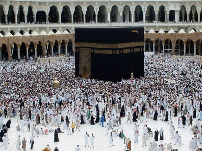 The Holy Kabah, Station of Abraham (golden blond matter on the left), Hicr Esmael (right to Kabah) and the muslims from every counrty circumambulating the Kabah in the Masjed al-Haraam in Mecca city of Saudi Arabia. Because everythings` Creator and Owner Allah (swt) said in the Holy Koran: ``The first House (of worship) appointed for men was that at Bakka; full of blessing and of guidance for all kinds of beings: In it are Signs manifest; (for example), the Station of Abraham; whoever enters it attains security; PILGRIMAGE THERETO IS A DUTY MEN OWE TO ALLAH, those who can afford the journey; but if any deny faith, Allah stands not in need of any of His creatures.`` (3:96,97) (The picture was taken by Mr. Mustafa one of the visitors of Artislamic.com in 2003 Ramadan.)
