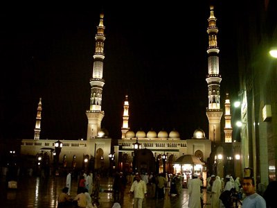 A nighttime view from the outside court of the Prophet Muhammad`s (saaw) Mosque (Masjed an-Nabawe) in Madina city of Saudi Arabia. (The picture was taken by Mr. Mustafa one of the visitors of Artislamic.com in 2003 Ramadan.)
