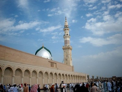 View of the Prophet Muhammad`s (saaw) Mosque (Masjed an-Nabawe) in Madina city of Saudi Arabia. On the area under the green dome there are tombs of the Prophet Muhammad, Abubakr (first caliph of Islam) and Omar (second caliph). At the same time there is home and minbar of the Prophet and ``soffa`` where the poor muslims used to stay and take education in the time of the Prophet. (The picture was taken by Mr. Mustafa one of the visitors of Artislamic.com in 2003 Ramadan.)