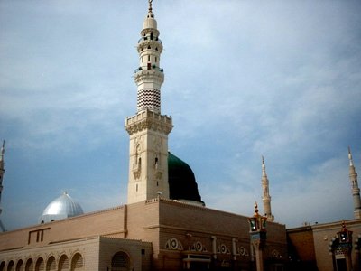 View of the Prophet Muhammad`s (saaw) Mosque (Masjed an-Nabawe) in Madina city of Saudi Arabia. On the area under the green dome there are tombs of the Prophet Muhammad, Abubakr (first caliph of Islam) and Omar (second caliph). At the same time there is home and minbar of the Prophet and ``soffa`` where the poor muslims used to stay and take education in the time of the Prophet. (The picture was taken by Mr. Mustafa one of the visitors of Artislamic.com in 2003 Ramadan.)