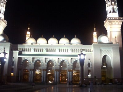 A nighttime view from the outside court of the Prophet Muhammad`s (saaw) Mosque (Masjed an-Nabawe) in Madina city of Saudi Arabia. (The picture was taken by Mr. Mustafa one of the visitors of Artislamic.com in 2003 Ramadan.)