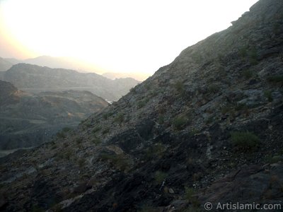 A picture of surrounding mounts taken while climbing the Mount Savr in Mecca city of Saudi Arabia. The Prophet Muhammed (saaw) and his friend Abu Bakr (ra) had got shut of the Meccan enemies tracking them by hidding three days in a cave in this mount with the great help of Allah (swt). (The picture was taken by Mr. Mustafa one of the visitors of Artislamic.com in 2003 Ramadan.)