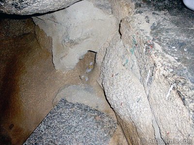 View of the inside of the Cave Savr on Mount Savr in Mecca city of Saudi Arabia. The Prophet Muhammed (saaw) and his friend Abu Bakr (ra) had got shut of the Meccan enemies tracking them by hidding three days in this cave with the great help of Allah (swt). Once the unbelieving enemies had come to the entrance of the cave but they returned without entering it. When the sound of their retreating steps and voices had died away, the Prophet and Abu Bakr went to the mouth of the cave. There over the entrance a spider had woven its web. They looked through the web, and there in the hollow of a rock, even where a man might step as he entered the cave, a rock dove had made a nesting place and was sitting close as if she had eggs, with her mate perched on a ledge not for above. (Sources: Le Prophte de l`Islam, Muhammad Hamidullah; The Life Of Prophet, Abubakr Seracudden [Martin Lings], The Hijrah). In the Holy Koran our Lord Allah said about the Savr Cave: ``If ye help not (Muhammad), (it is no matter): for Allah did indeed help him, when the unbelievers drove him out: he had no more than one companion: they two were in the Cave, and he said to his companion, ``Have no fear for Allah is with us``: then Allah sent down His peace upon him, and strengthened him with forces which ye saw not, and humbled to the depths the word of the unbelievers. But the word of Allah is exalted to the heights: for Allah is Exalted in might, Wise.`` (The Holy Koran 9:40). (The picture was taken by Mr. Mustafa one of the visitors of Artislamic.com in 2003 Ramadan.)