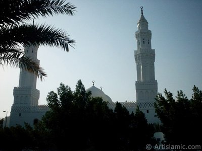 Masjed Qiblatayn (mosque with two qiblas) located in Kuba Village in Madina city of Saudi Arabia. Qibla means the direction of Kabah in Mecca city of Saudi Arabia to which a Muslim turns in worship. In the beginning of Islam the first muslims were worshipping by turning to Masjed al-Aksa at Qudus (Jerusalem). Later our Lord Allah ordered muslims to turn their faces to Kabah in worship (The Holy Koran 2:144). Once the first muslims in this mosque were worshipping in the morning in group. When a muslim coming from the Prophet`s city informed them about the change of the qibla they turned to the new qibla on the place they are without breaking the worship. [Source: Muslim, Masaced 15, (527); Abu Davud, Salah 206, (1045)]. So, from that day this mosque called as ``Mosque with two qiblas`` (Masjed Qiblatayn). Later, the mosque rebuiled a few times. (The picture was taken by Mr. Mustafa one of the visitors of Artislamic.com in 2003 Ramadan.)