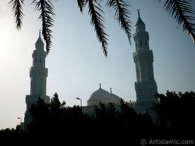 Masjed Qiblatayn (mosque with two qiblas) located in Kuba Village in Madina city of Saudi Arabia. Qibla means the direction of Kabah in Mecca city of Saudi Arabia to which a Muslim turns in worship. In the beginning of Islam the first muslims were worshipping by turning to Masjed al-Aksa at Qudus (Jerusalem). Later our Lord Allah ordered muslims to turn their faces to Kabah in worship (The Holy Koran 2:144). Once the first muslims in this mosque were worshipping in the morning in group. When a muslim coming from the Prophet`s city informed them about the change of the qibla they turned to the new qibla on the place they are without breaking the worship. [Source: Muslim, Masaced 15, (527); Abu Davud, Salah 206, (1045)]. So, from that day this mosque called as ``Mosque with two qiblas`` (Masjed Qiblatayn). Later, the mosque rebuiled a few times. (The picture was taken by Mr. Mustafa one of the visitors of Artislamic.com in 2003 Ramadan.)